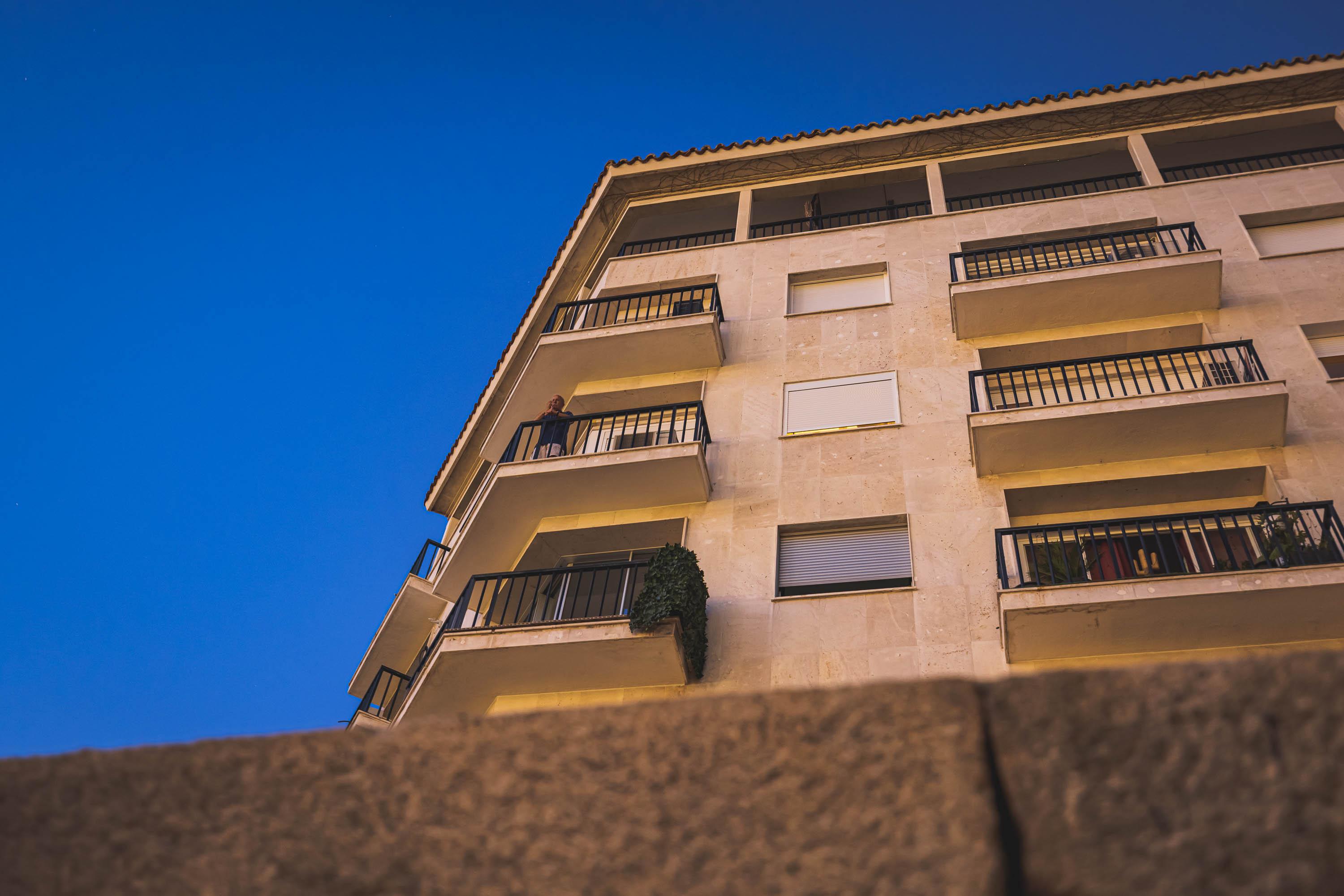 A man enjoying the view in the previous photo from his balcony dircetly above me
