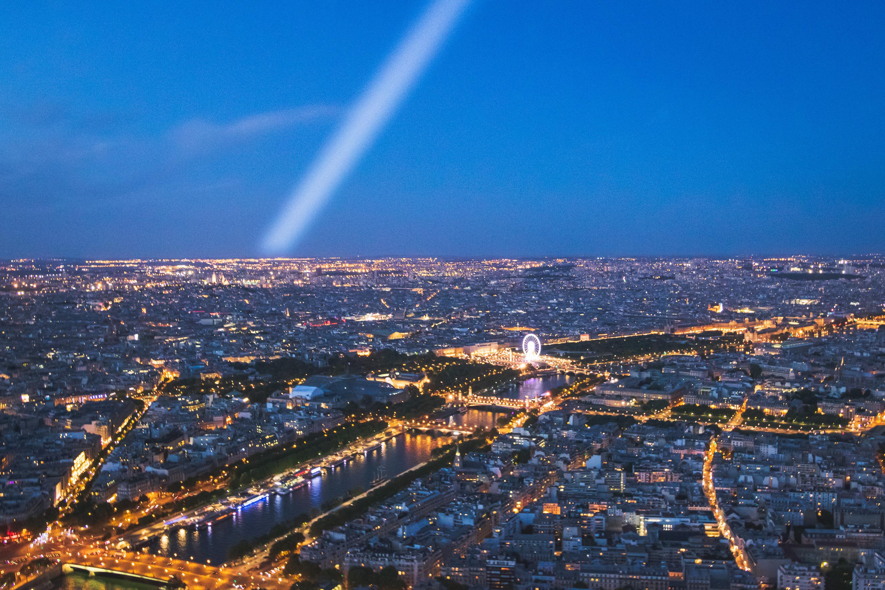 The aqueduct in Segovia shining in the morning light as people go about their day