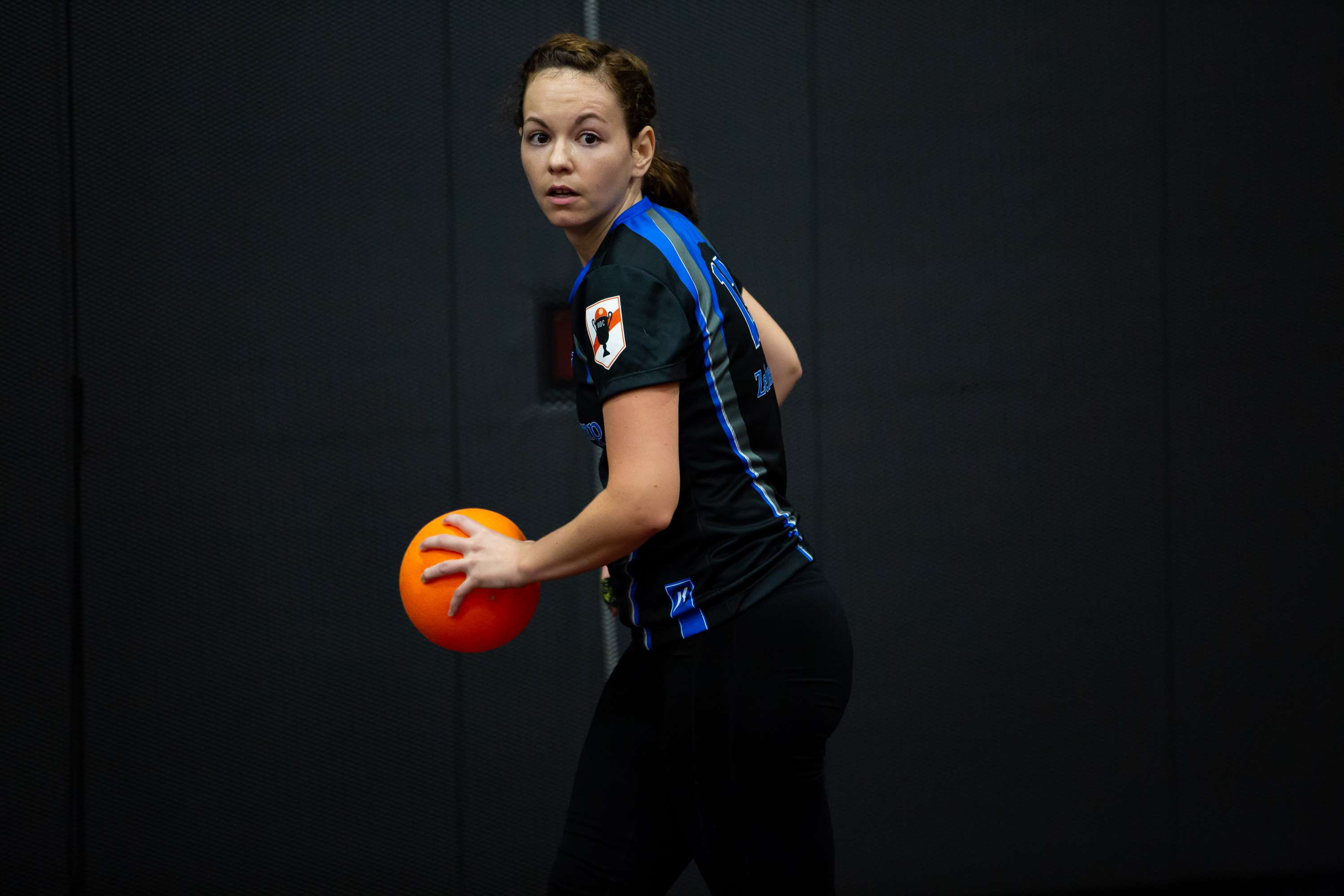 A player surveys the court while holding a ball