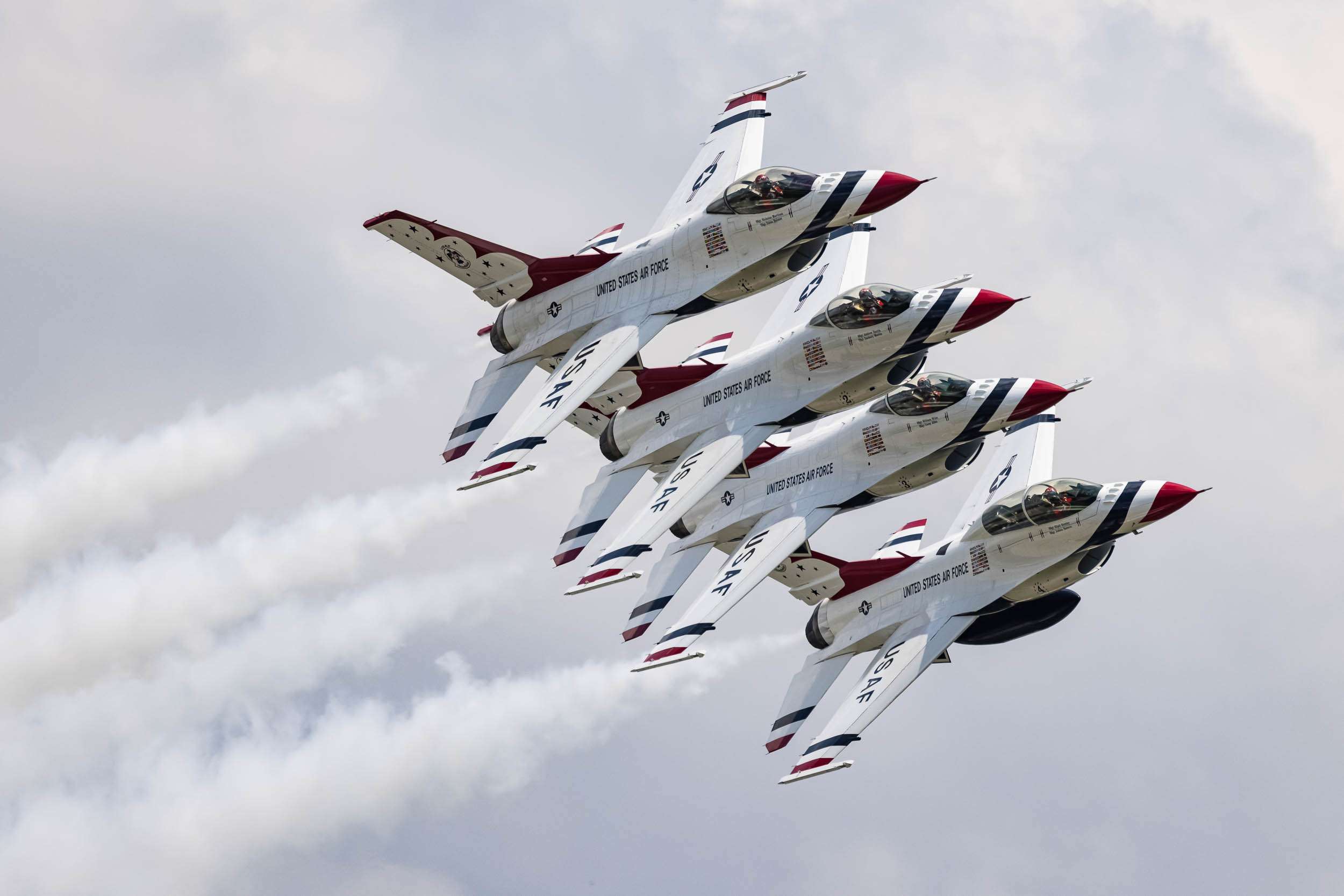 Jets from the US Air Force Thunderbirds pass in tight echelon formation