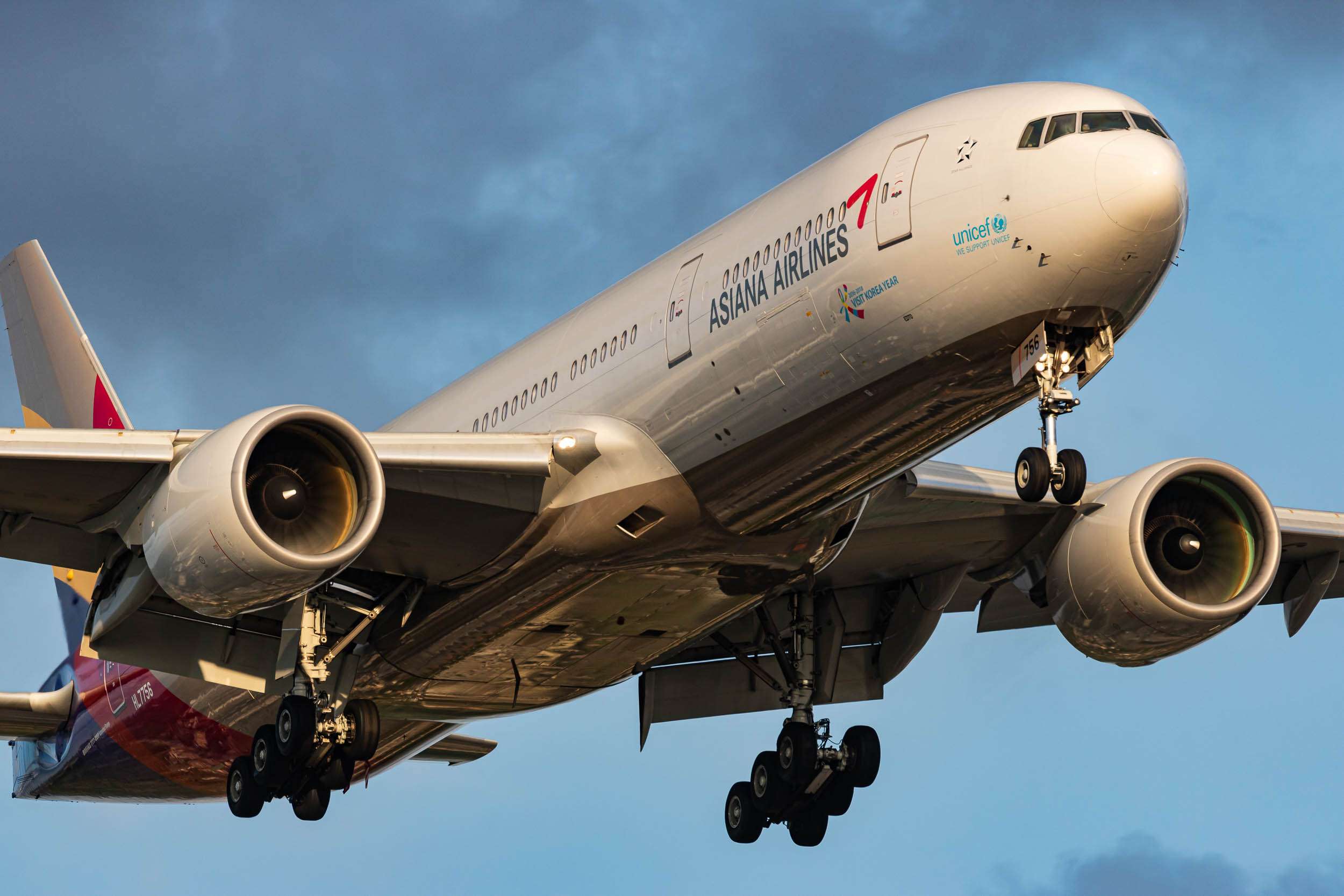 A closeup shot of an Asiana Airlines 777 landing